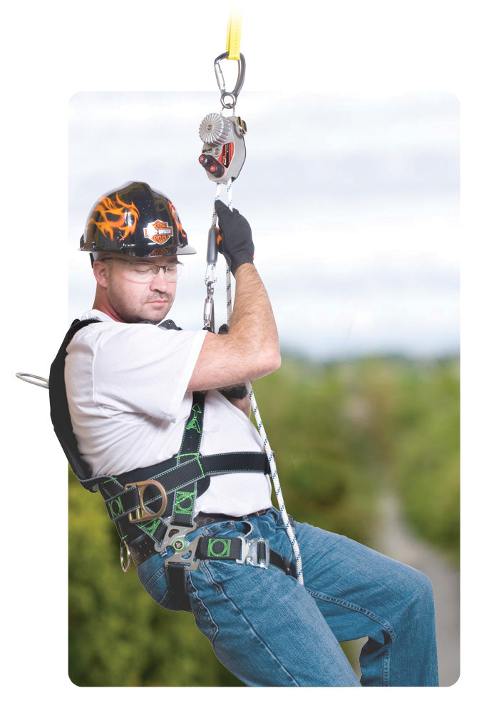 Person wearing a full-body safety harness with a helmet and A SafEscape controlled rope descender device with a metal wheel